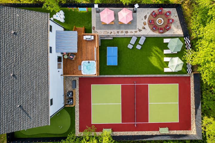 Aerial view of the private backyard and pickleball court