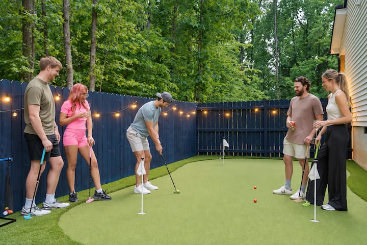 Friends playing on the private putting green